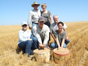 The Brown family with the 25 billionth bushel. Mike and his wife Jeanene are in the back row. From left to right in the front row Carla, and Tanner Brown, with sister and brother in law. 